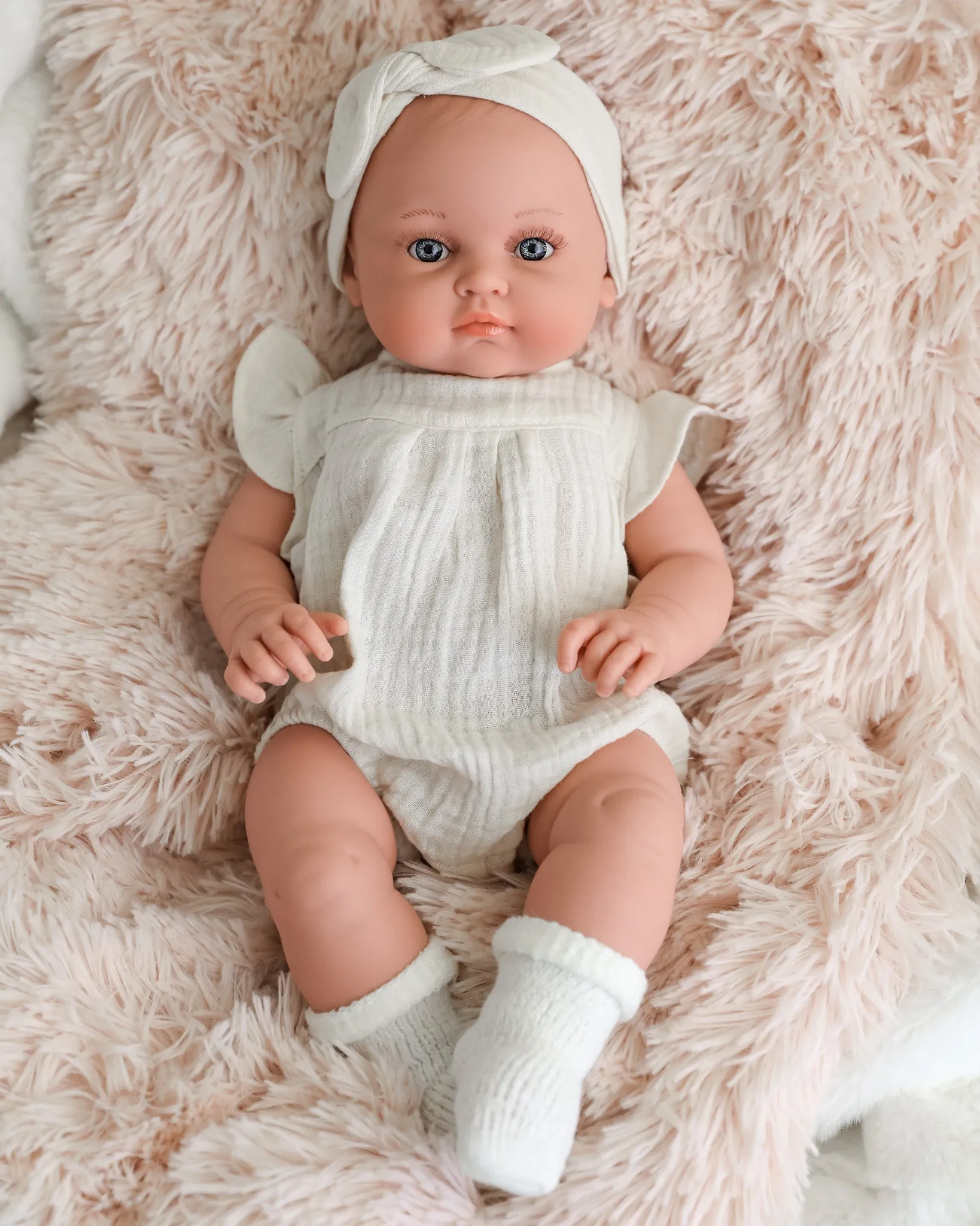 Minikane Doll | 18" Bambini Girl Doll Yaelle in White Romper