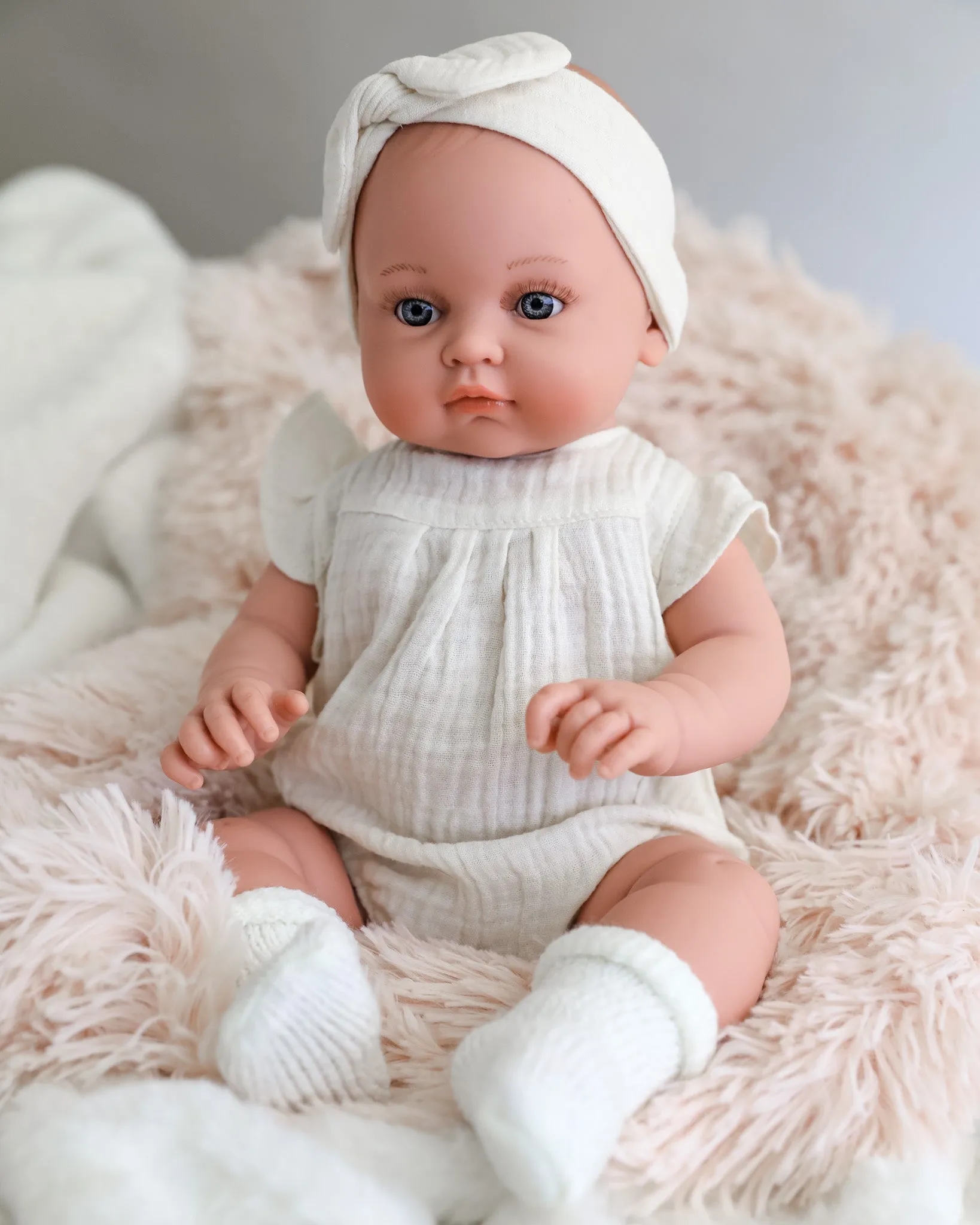 Minikane Doll | 18" Bambini Girl Doll Yaelle in White Romper