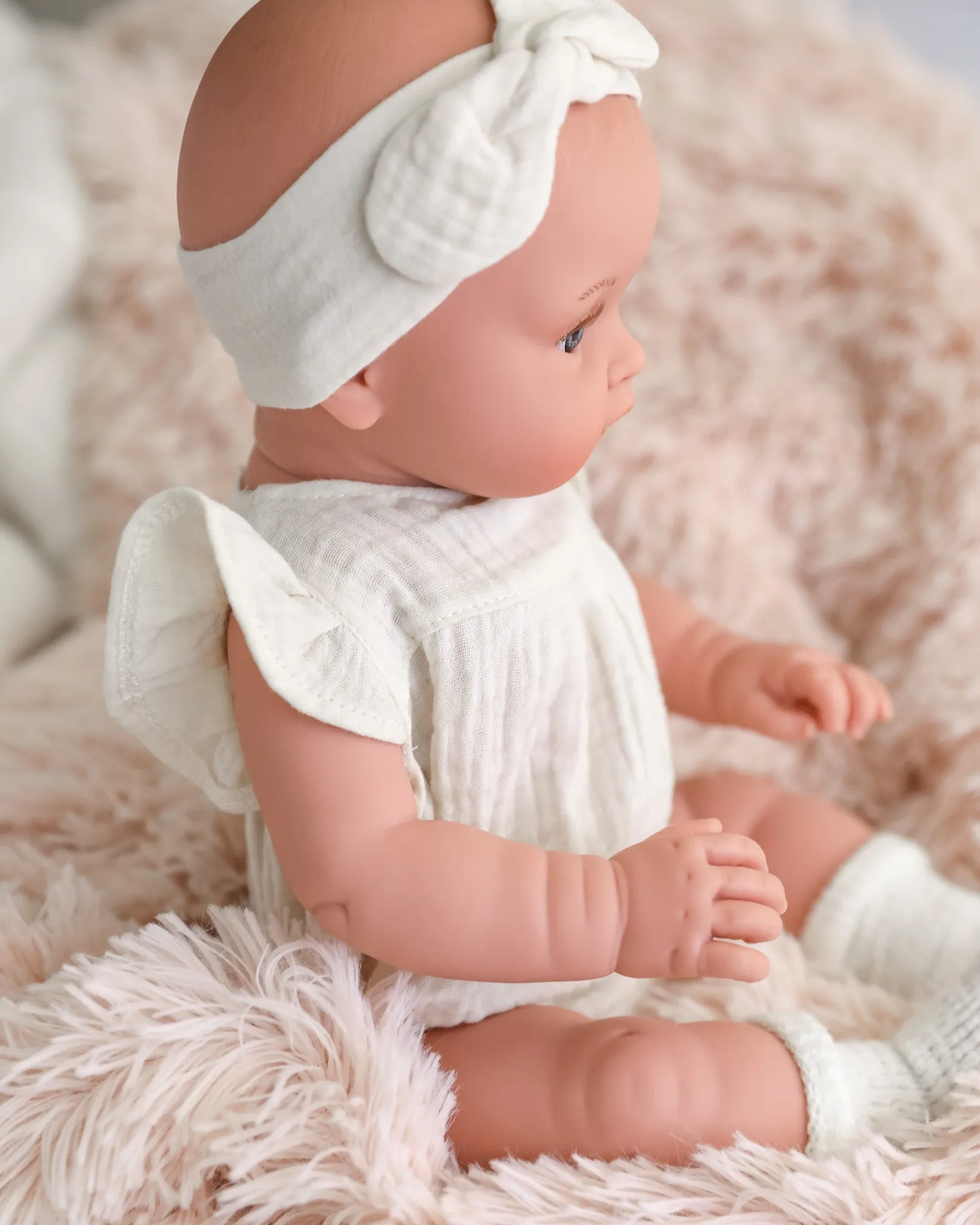 Minikane Doll | 18" Bambini Girl Doll Yaelle in White Romper