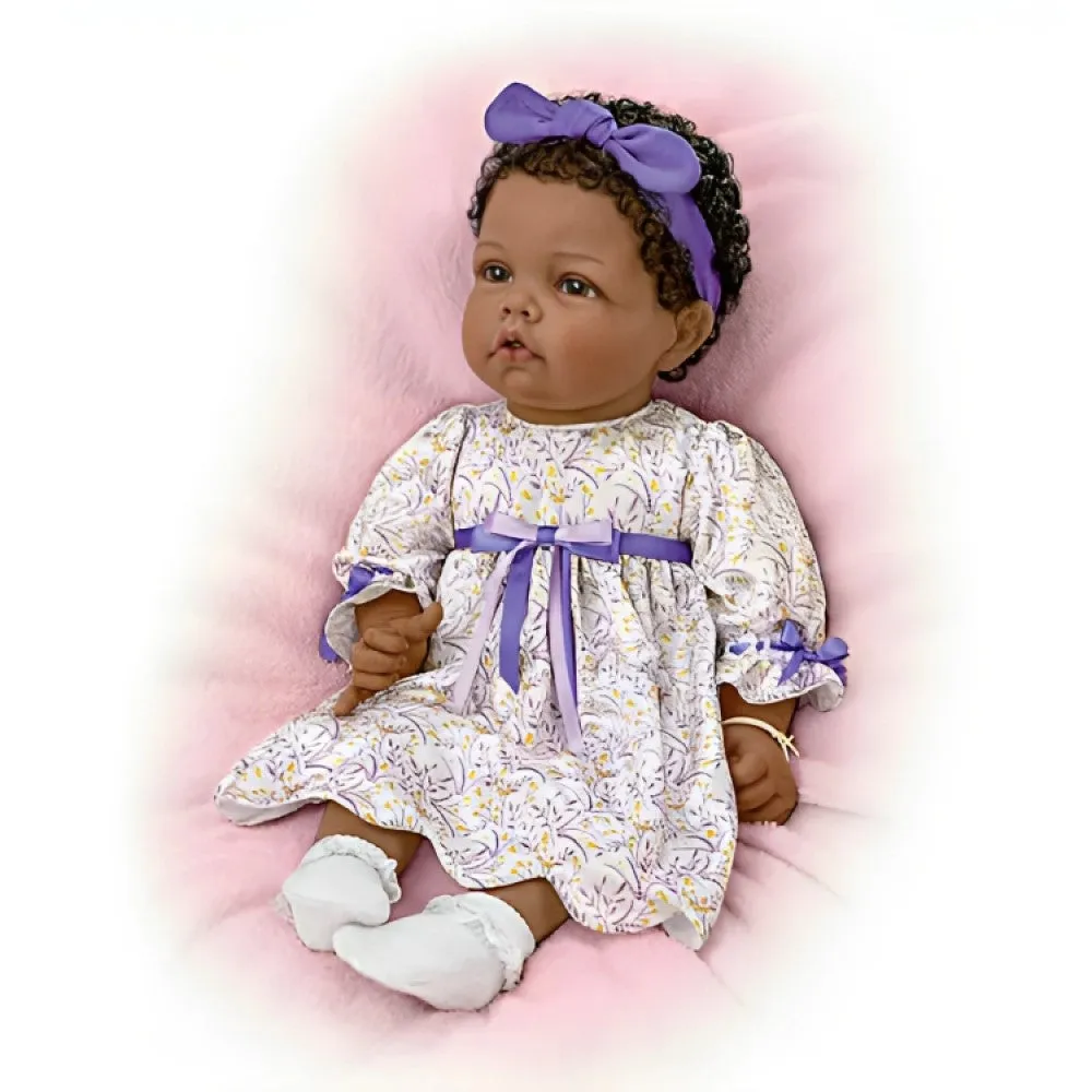 The Ashton-Drake Galleries So Truly Real All God's Grace in One Tiny Face Lifelike Baby Doll with A Cross Bracelet and Featuring A Purple-Accented Dress 20-inches