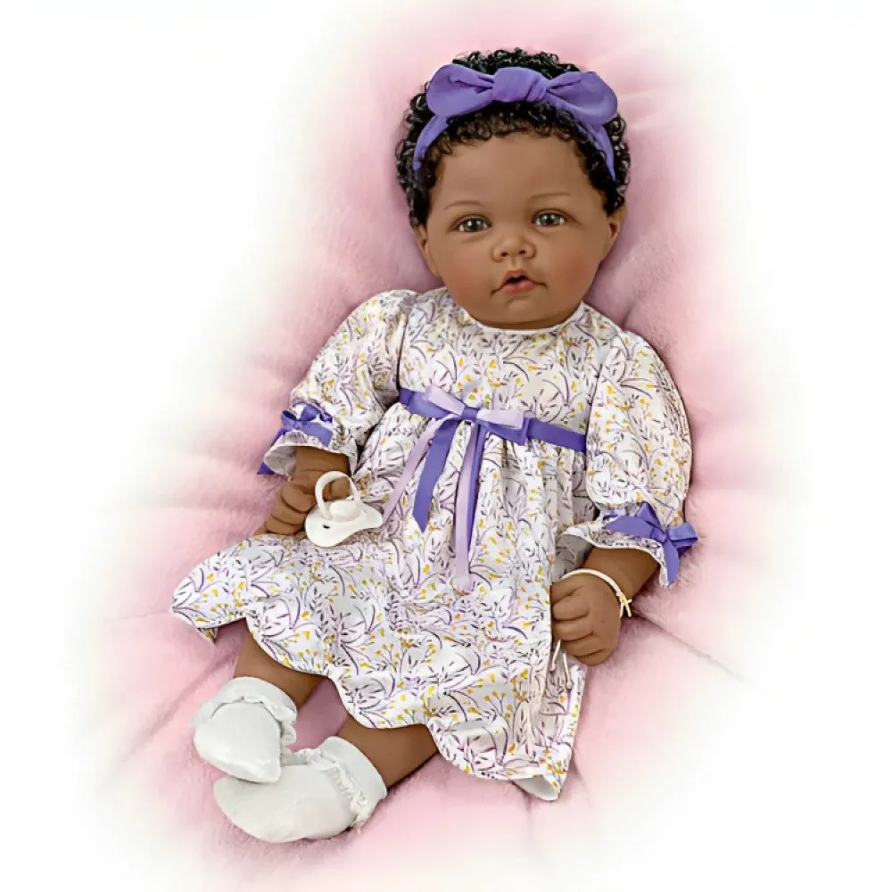 The Ashton-Drake Galleries So Truly Real All God's Grace in One Tiny Face Lifelike Baby Doll with A Cross Bracelet and Featuring A Purple-Accented Dress 20-inches