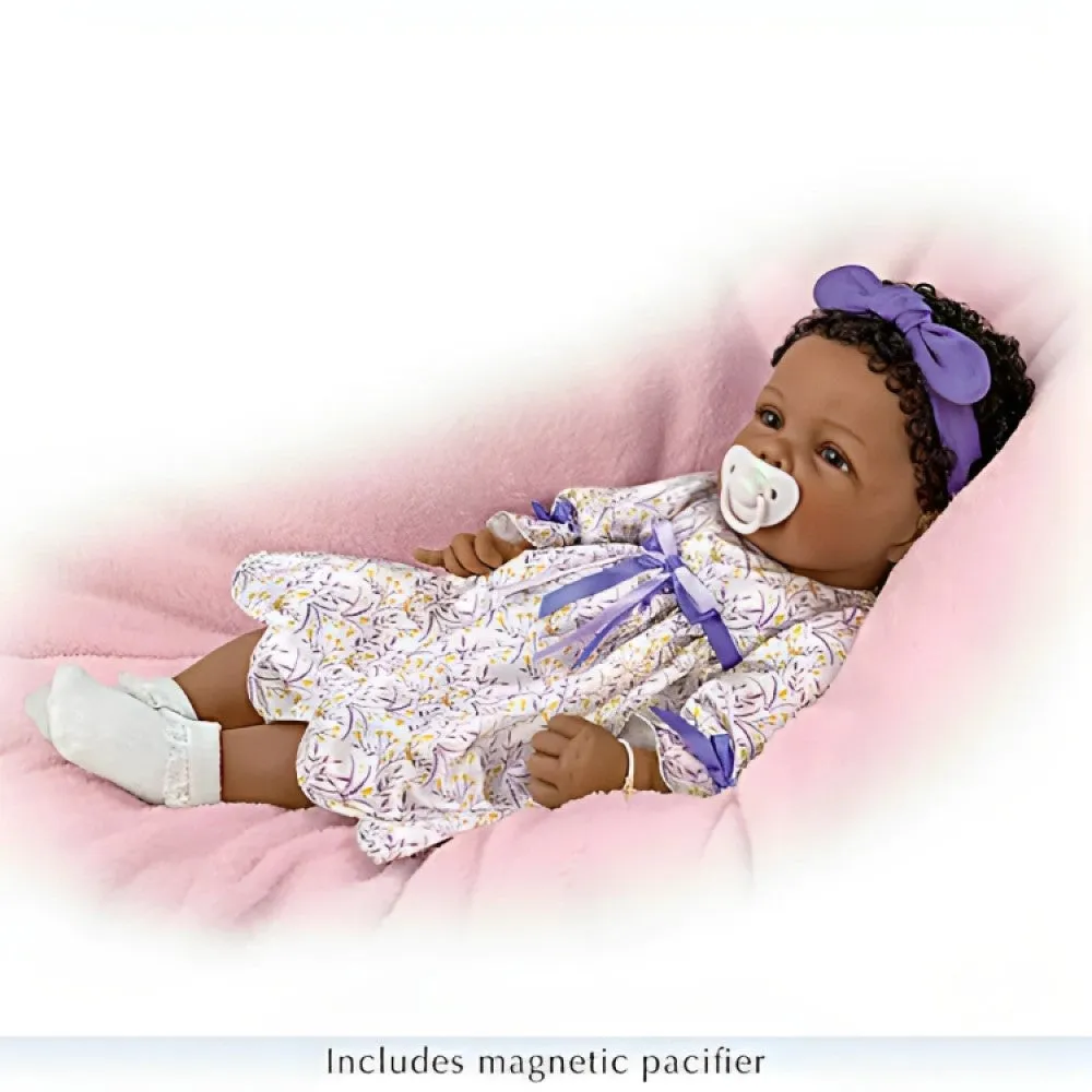 The Ashton-Drake Galleries So Truly Real All God's Grace in One Tiny Face Lifelike Baby Doll with A Cross Bracelet and Featuring A Purple-Accented Dress 20-inches