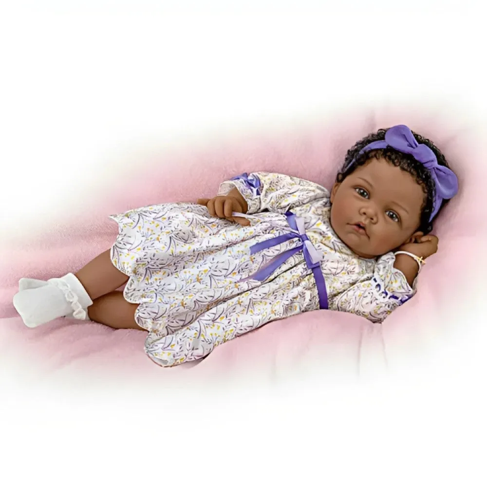 The Ashton-Drake Galleries So Truly Real All God's Grace in One Tiny Face Lifelike Baby Doll with A Cross Bracelet and Featuring A Purple-Accented Dress 20-inches